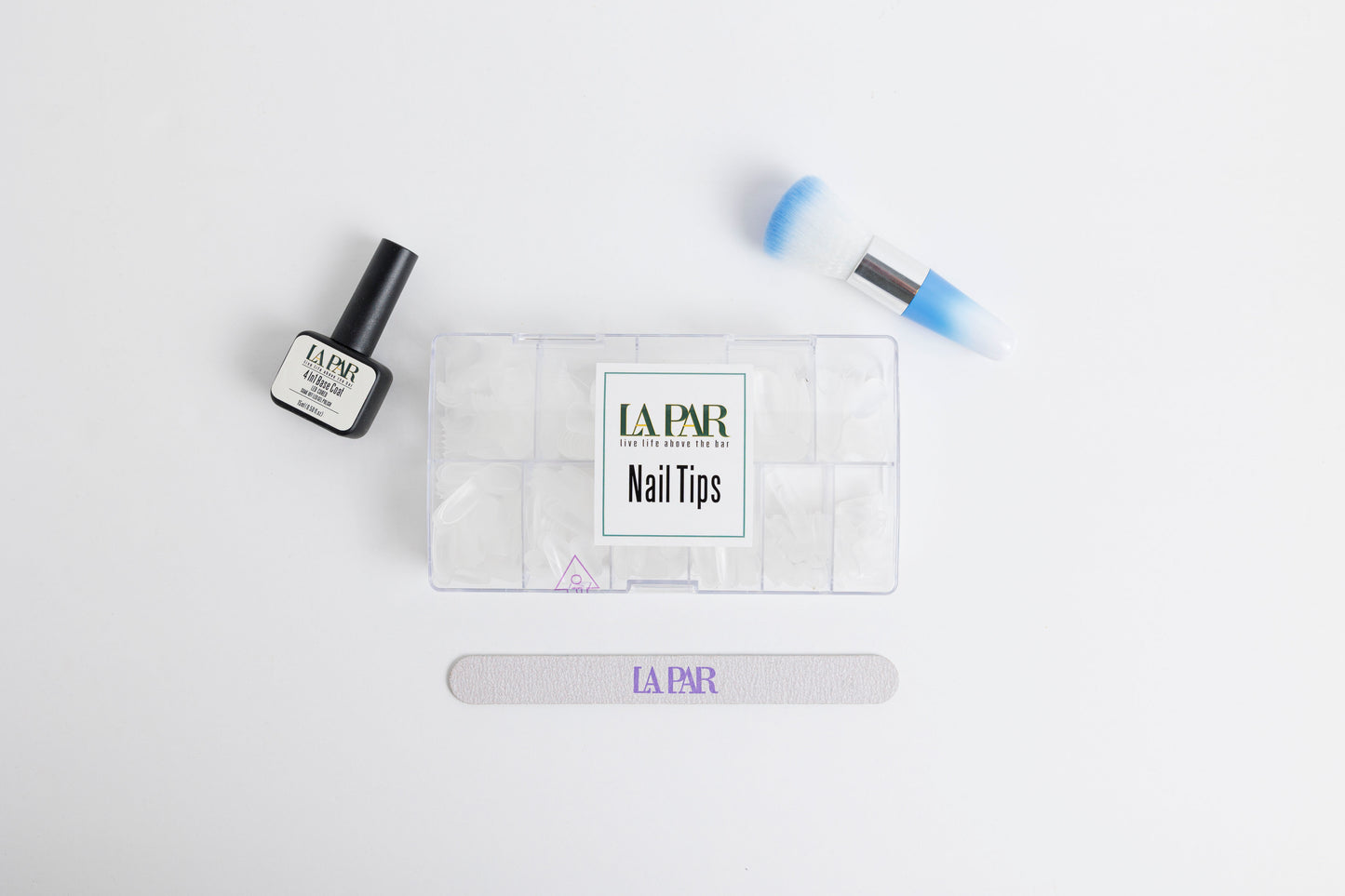 Birdseye view of La Par Nail Tips kit with nail tips, brush, 4 in 1 base coat and La Par nail file