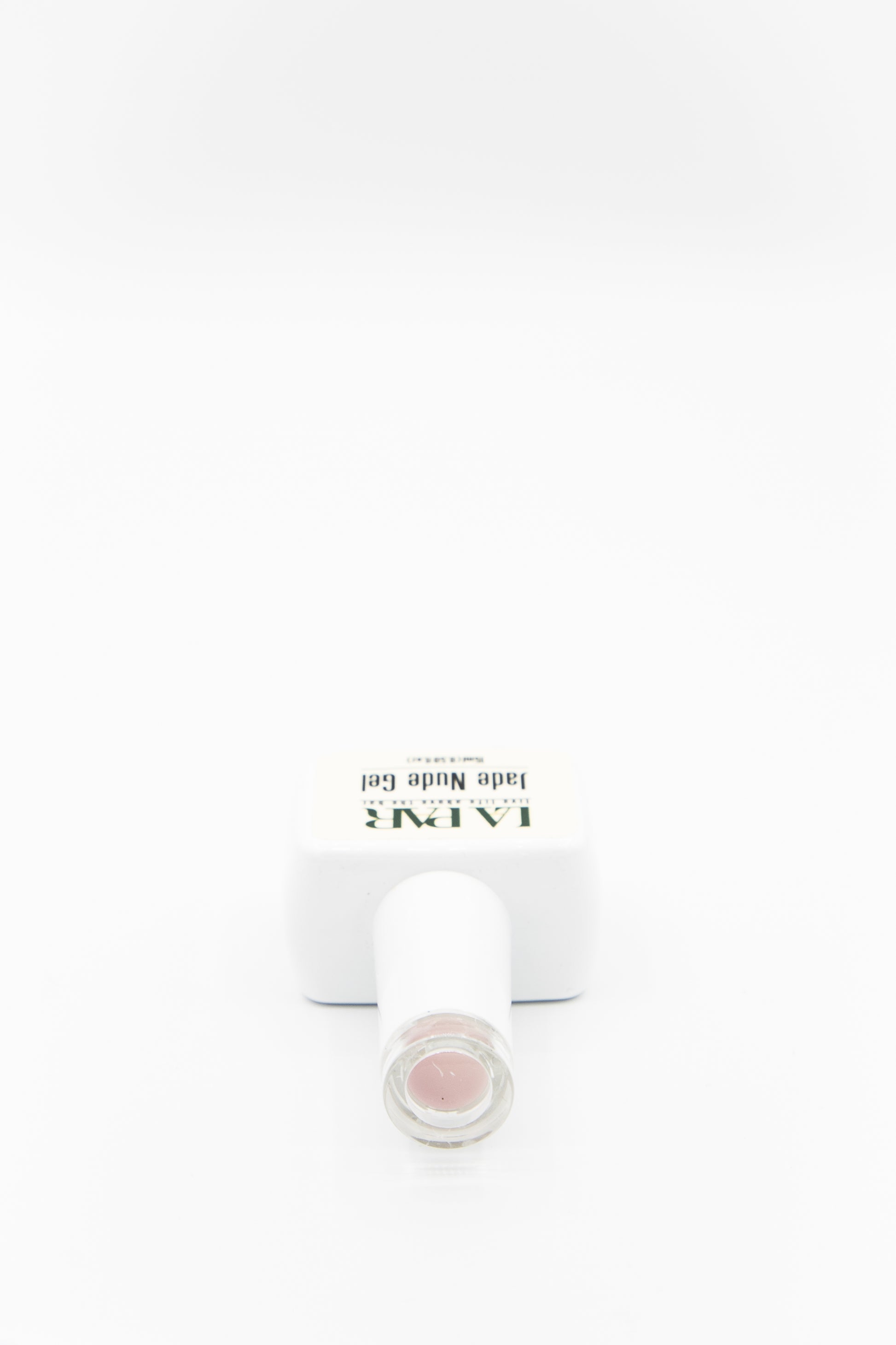 La ParPersephone #83 Jade Nude Gel Polish bottle cap lying down